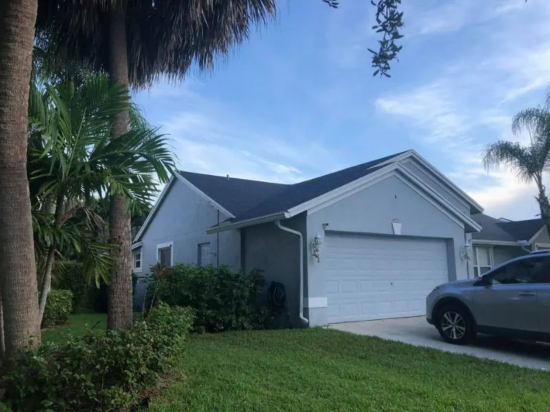 Blue-gray home with a gray architectural shingle roof